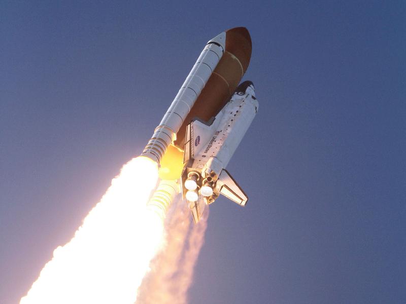 Space Shuttle Discovery blasts off