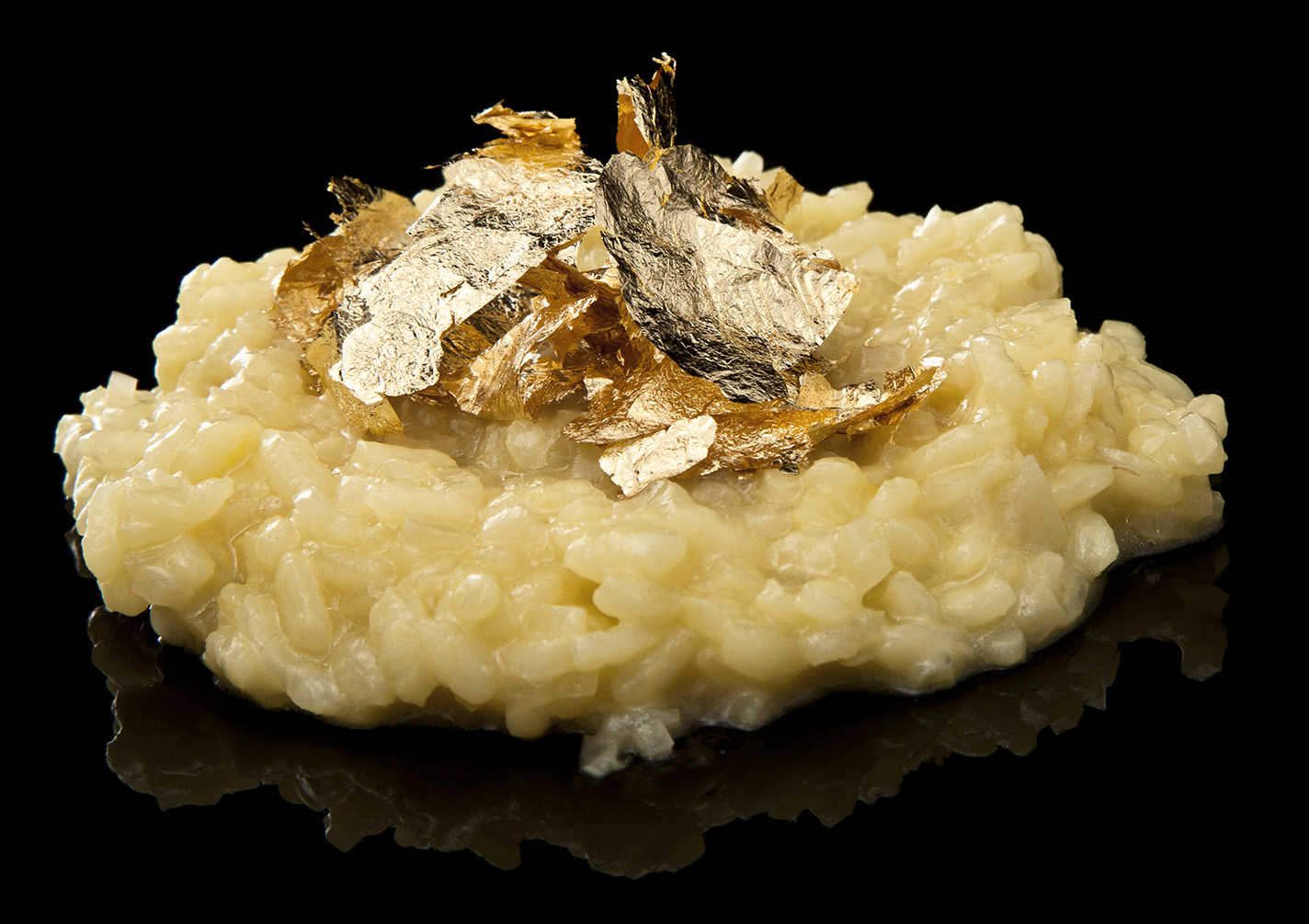 Gualtiero Marchesi garnished the classic Northern Italian dish, Risotto Milanese, with gold leaf, as do we.
