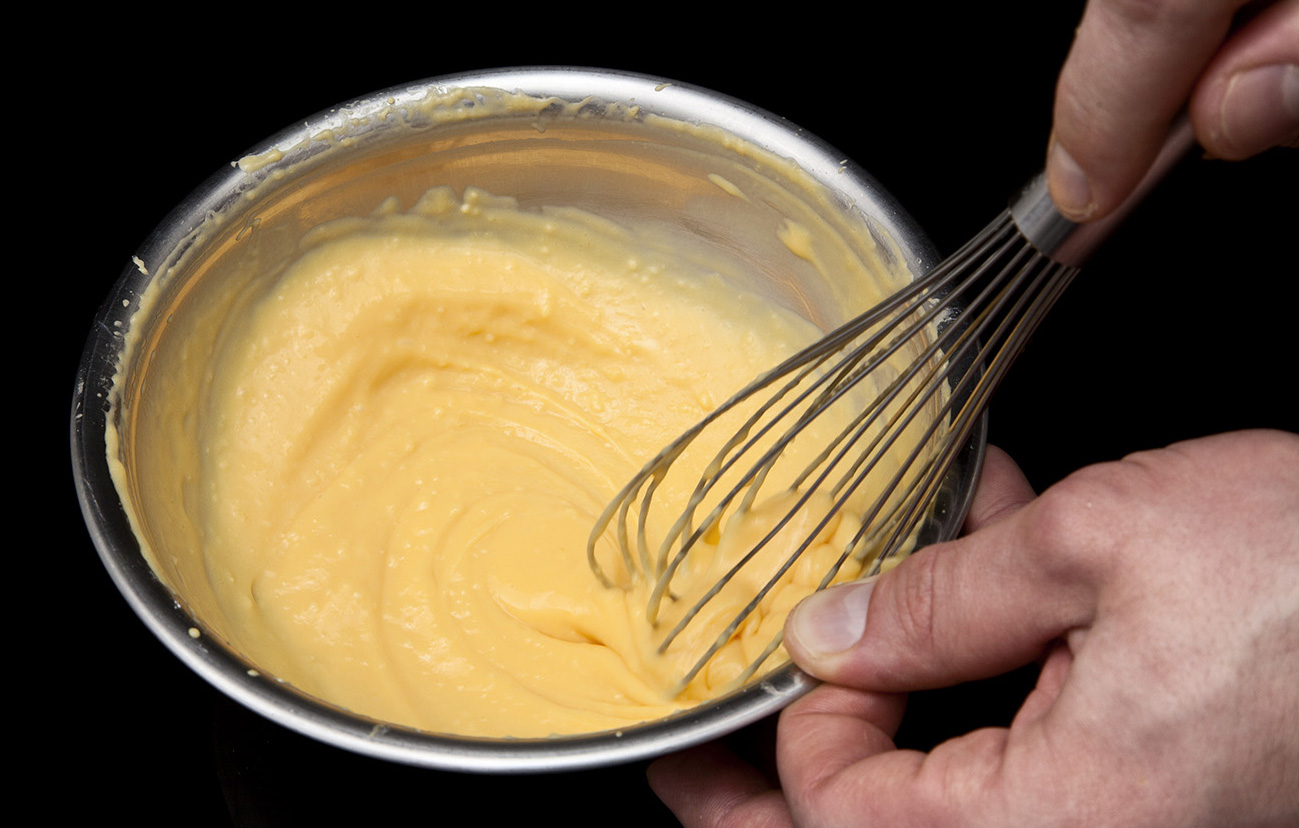 Whisk the cheese water into the Crisp Coat UC, Ultra-Sperse M, and salt to form a a paste.