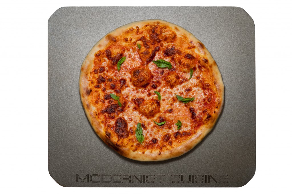 Modernist Cuisine Special Edition Baking Steel with cheese and basil pizza